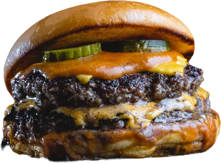 Hamburguesa doble con bordes crocantes, queso fundido y pepinillos